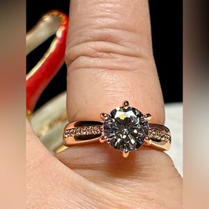 Rose gold plated engagement ring style with pave stone shoulders